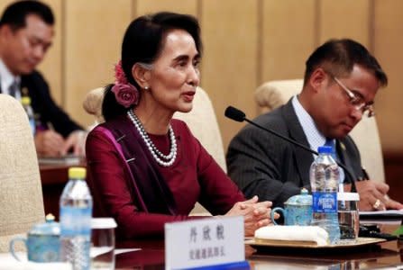 Myanmar State Counsellor Aung San Suu Kyi (L) speaks during a meeting with Chinese Premier Xi Jinping (not in photo) at the Diaoyutai State Guesthouse in Beijing, China, August 19, 2016. REUTERS/Rolex Dela Pena/Pool