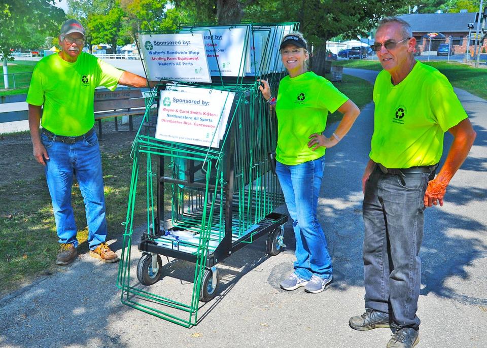 Ray Leisy, Kelly Riley, and Tom Dilyard spent the day installing recycling bins throughout the fairgrounds recently.