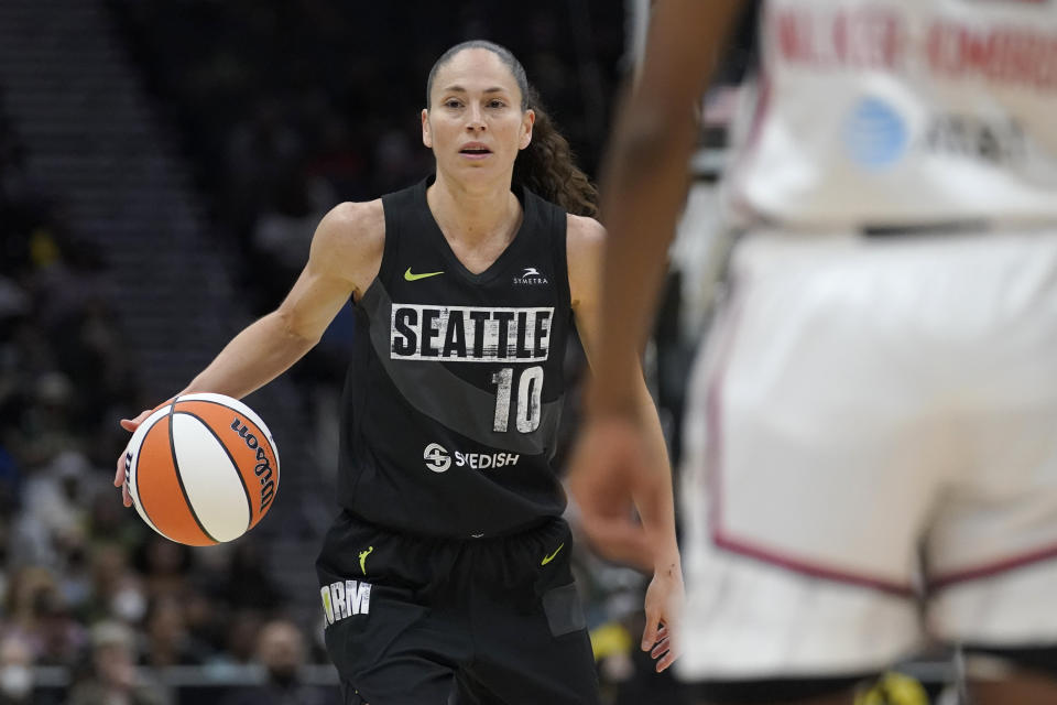Seattle Storm guard Sue Bird looks to pass the ball against the Washington Mystics during the first half of a WNBA basketball playoff game, Sunday, Aug. 21, 2022, in Seattle. (AP Photo/Ted S. Warren)