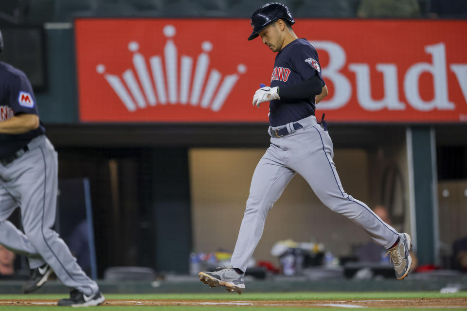 Cleveland Guardians' Steven Kwan crosses home plate after hitting a lead off home run during the first inning of a baseball game against the Texas Rangers, Sunday, July 16, 2023, in Arlington, Texas. (AP Photo/Gareth Patterson)