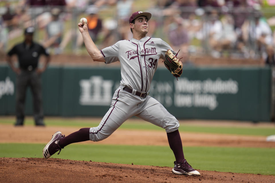 Texas A&M pitcher Micah Dallas (34) throws to home against Louisville during an NCAA college baseball super regional tournament game Saturday, June 11, 2022, in College Station, Texas. (AP Photo/Sam Craft)