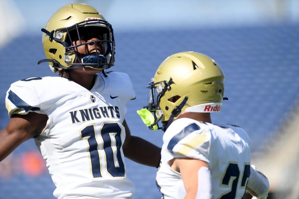 Hoban quarterback Tylan Boykin celebrates a first-quarter touchdown with Parker Falkenstein against Frederick Douglass at Tom Benson Hall of Fame Stadium on Saturday.