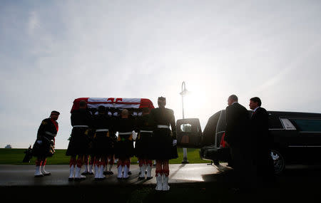 Soldiers load the coffin into a hearse during the funeral procession for Cpl. Nathan Cirillo in Hamilton, Ontario October 28, 2014. REUTERS/Mark Blinch