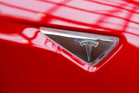 A Tesla logo on a Model S is photographed inside of a Tesla dealership in New York, U.S., April 29, 2016. REUTERS/Lucas Jackson/File Photo -