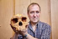 The Natural History Museum's Professor Chris Stringer is seen holding the Broken Hill skull