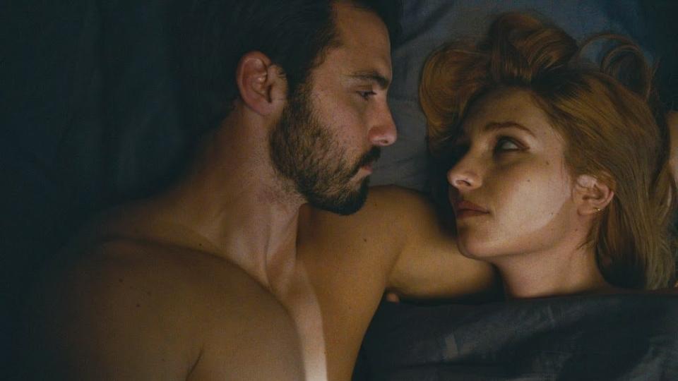 Milo Ventimiglia lies next to the bloodsucking vampire Josephine de La Baume in Kiss of the Damned.