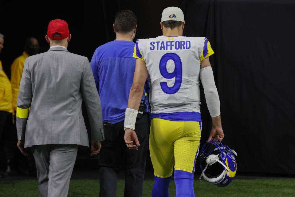 Rams quarterback Matthew Stafford leaves the field after suffering a concussion Nov. 20 at New Orleans.