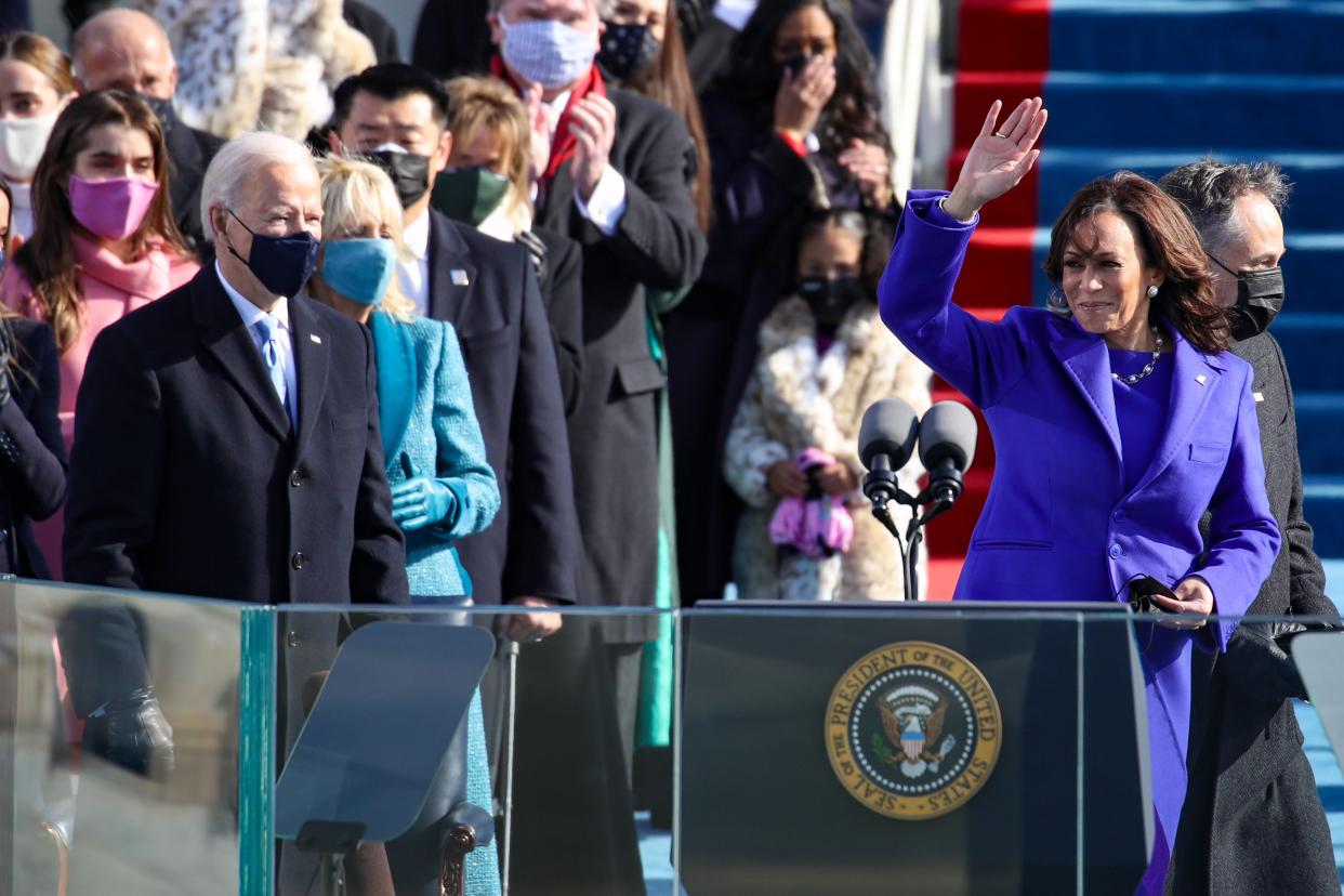 <p>Newly sworn in Vice President Kamala Harris waves to the crowd during the inauguration of U.S. President-elect Joe Biden on the West Front of the U.S. Capitol on January 20, 2021 in Washington, DC. </p> (Photo by Rob Carr/Getty Images)