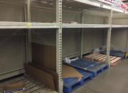 In this Thursday, Dec. 15, 2016 photo, empty shelves are left after residents rushed to H-E-B to buy water after a recent back-flow incident in the industrial district according to a city news release, in Corpus Christi, Texas. (Gabe Hernandez/Corpus Christi Caller-Times via AP)