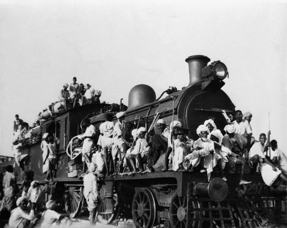 Riots in India, Refugees Leaving: Hundreds of Muslim refugees jam inside and atop the coaches of this train leaving the New Delhi area for Pakistan on Sept. 27, 1947. (AP Photo)