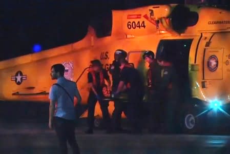 Injured people from a clinic in Great Abaco Island's Marsh Harbour arrive after being evacuated in a U.S. Coast Guard helicopter