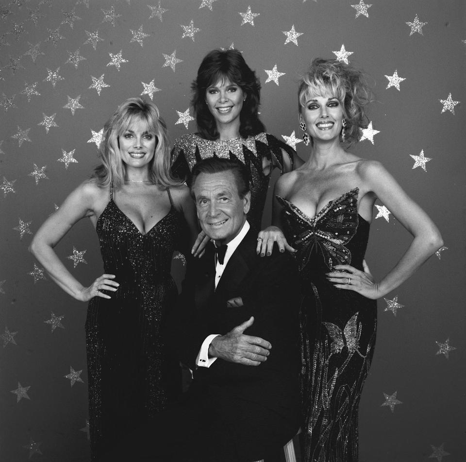 Bob Barker with from left: Dian Parkinson, Holly Halstrom and Janice Pennington in 1986. (CBS Photo Archive / CBS via Getty Images)