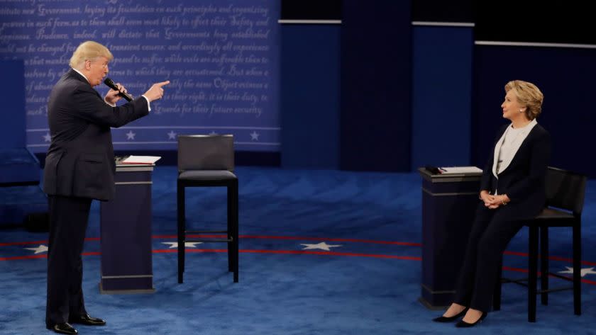 2016 AP YEAR END PHOTOS - Republican presidential nominee Donald Trump speaks to Democratic presidential nominee Hillary Clinton during the second presidential debate at Washington University in St. Louis, on Oct. 9, 2016. (AP Photo/Patrick Semansky, File)