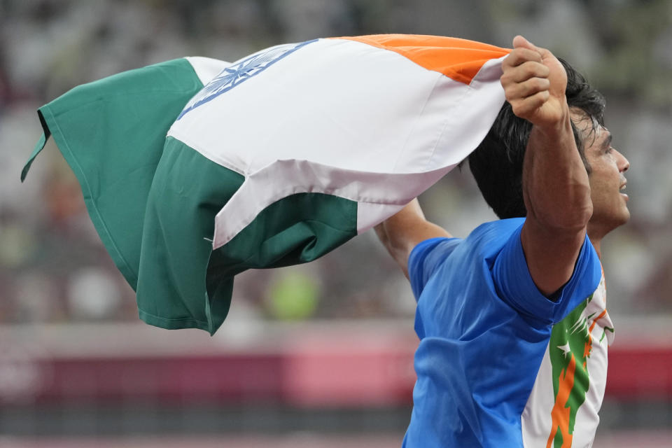 Neeraj Chopra, of India, celebrates after winning the men's javelin throw at the 2020 Summer Olympics, Saturday, Aug. 7, 2021, in Tokyo. (AP Photo/Martin Meissner)