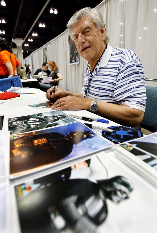 FILE PHOTO: David Prowse, who portrayed Darth Vader, signs autographs during the opening day of Star Wars Celebration IV in Los Angeles