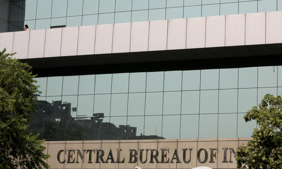 A woman looks from the balcony of Central Bureau of Investigation headquarters in New Delhi, India, Wednesday, Oct. 24, 2018. The government of India placed the director of the federal investigative agency and his deputy on leave on Wednesday days after the agency filed a case against the deputy alleging that he took bribes to settle a money laundering case. (AP Photo/Altaf Qadri)