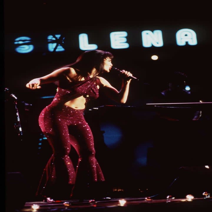 Selena performing in a jumpsuit in Selena