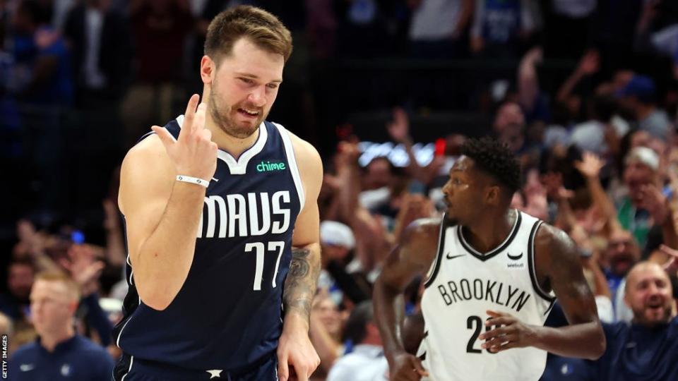 Luka Doncic #77 of the Dallas Mavericks reacts after hitting a three-pointer against the Brooklyn Nets