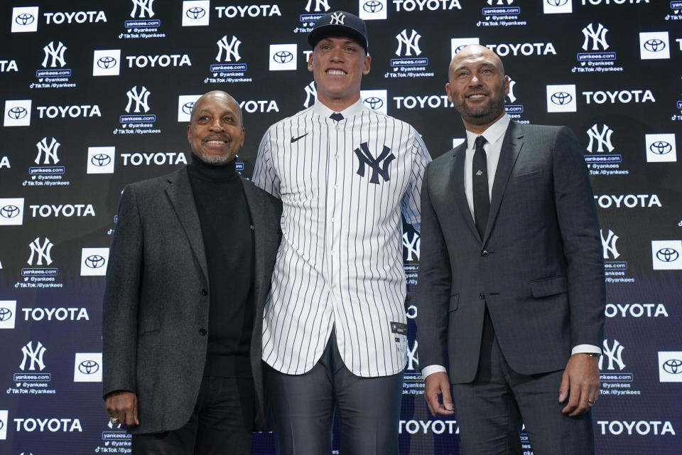 New York Yankees' captain Aaron Judge, center, poses for a picture with former Yankees captains Derek Jeter, right, and Willie Randolph during a news conference at Yankee Stadium, Wednesday, Dec. 21, 2022, in New York. Judge has been appointed captain of the New York Yankees after agreeing to a $360 million, nine-year contract to remain in pinstripes. (AP Photo/Seth Wenig)