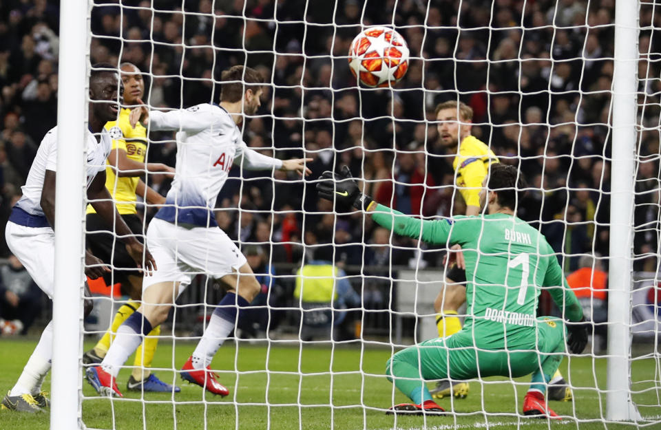 Tottenham forward Fernando Llorente, background center, celebrates after scoring his side's third goal during the Champions League round of 16, first leg, soccer match between Tottenham Hotspur and Borussia Dortmund at Wembley stadium in London, Wednesday, Feb. 13, 2019. (AP Photo/Alastair Grant)