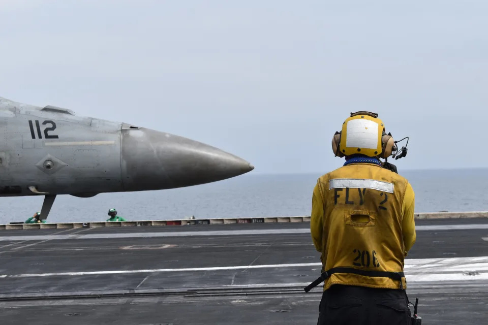 A fighter jet prepares for take off on the USS Dwight D. Eisenhower.