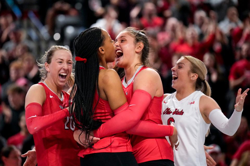 Nov 26, 2022; Columbus, Ohio, United States;  Left to right, Ohio State University’s Rylee Radar (20), Jenaisya Moore (18), Gabby Gonzales (8) and Kylie Murr (6) celebrate in between points at Covelli Center during the NCAA division I women’s volleyball game between Ohio State University and the University of Wisconsin. Mandatory Credit: Joseph Scheller-The Columbus Dispatch