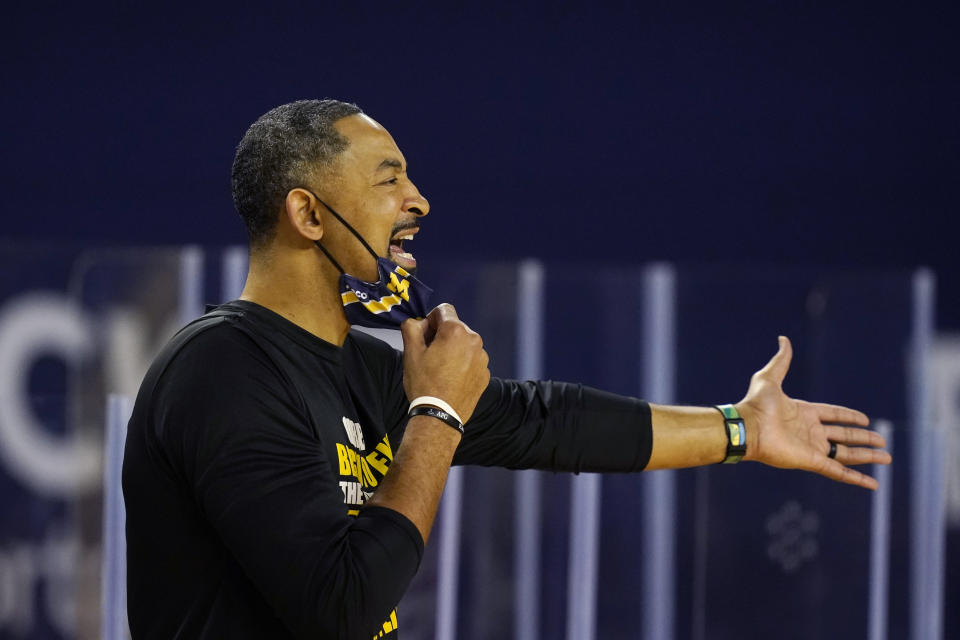 Michigan head coach Juwan Howard yells from the sideline during the first half of an NCAA college basketball game against Maryland, Tuesday, Jan. 19, 2021, in Ann Arbor, Mich. (AP Photo/Carlos Osorio)