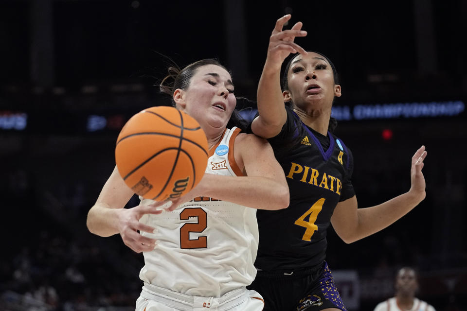 Texas guard Shaylee Gonzales (2) and East Carolina guard Synia Johnson (4) chase a loose ball during the first half of a first-round college basketball game in the NCAA Tournament in Austin, Texas, Saturday, March 18, 2023. (AP Photo/Eric Gay)