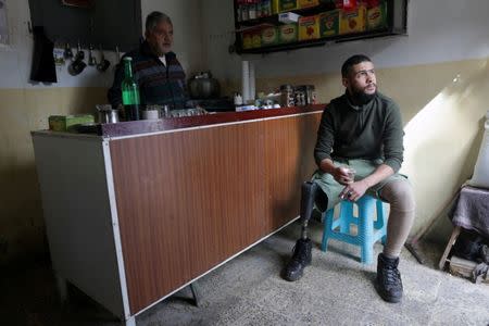 Mutassim al-Misrati, a Benghazi-local who lost his leg during a three-year war in the city, drinks coffee in Benghazi, Libya December 27, 2017. Picture taken December 27, 2017. REUTERS/Esam Omran Al-Fetori