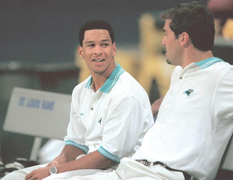 Carolina Panthers wide receiver Rae Carruth talks with teammate Jason Peter on the bench before the team’s game against the St. Louis Rams in St. Louis on Nov. 14, 1999. Within the next 48 hours his life, and many others, would change forever when his pregnant girlfriend Cherica Adams was shot four times in Charlotte.