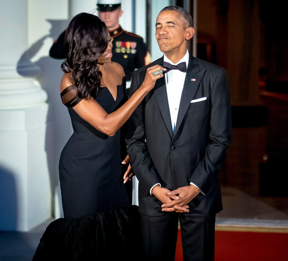 Michelle Obama gives Barack Obama some of that ‘mom-in-chief’ treatment. She says that Obama wore the same tux for every engagement for eight years. (Photo: Getty Images)