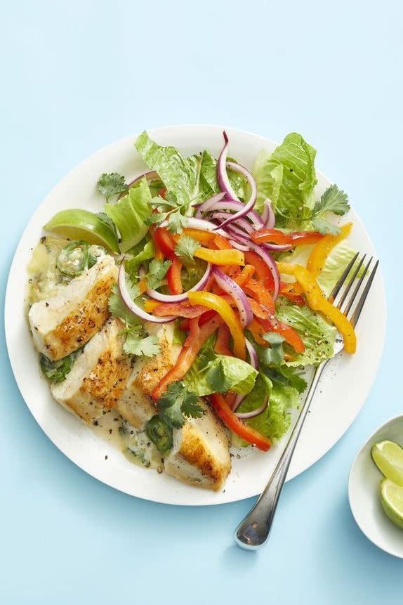 cheesy tex mex stuffed chicken and a green side salad with bell peppers