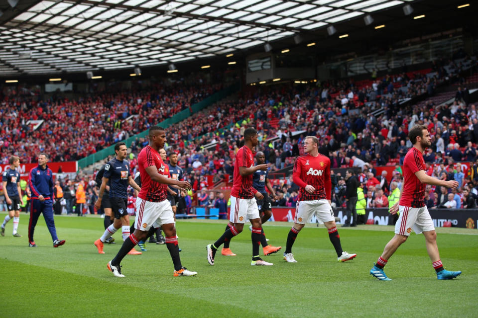 Wayne Rooney, second from right, of Manchester United leaves the field with his teammates before the match between Manchester United and AFC Bournemouth was called off at Old Trafford stadium on May 15, 2016, in Manchester, England. (Alex Livesey/Getty Images)