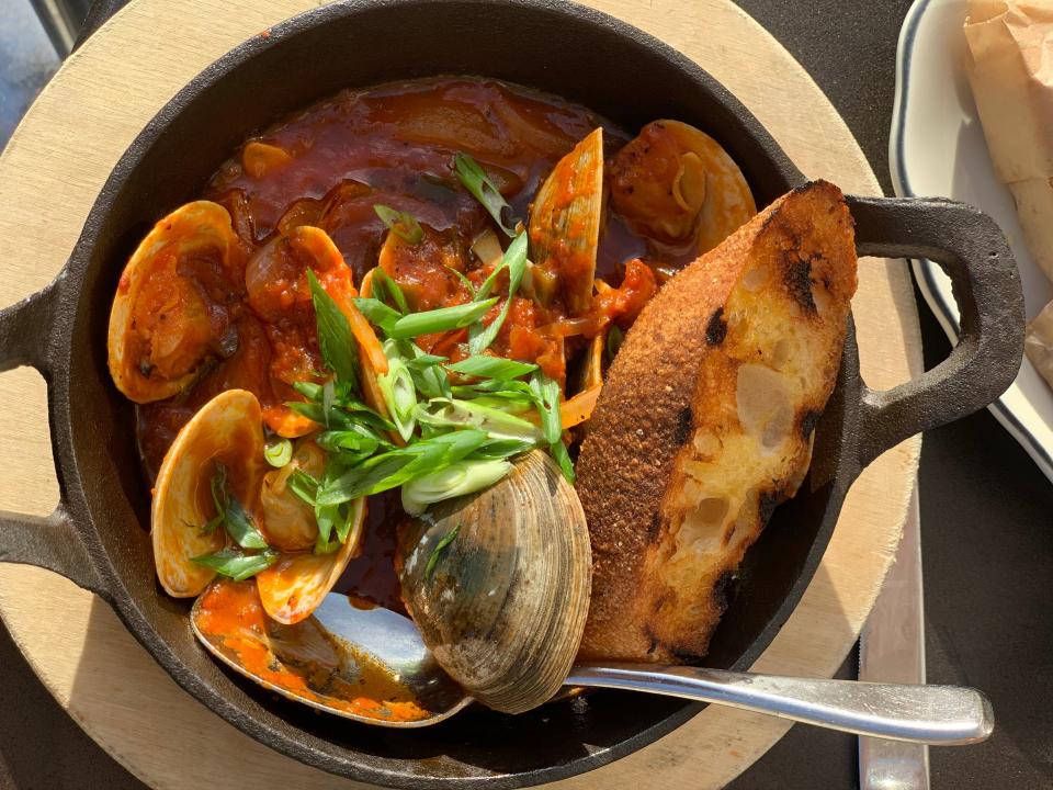 clam dish in a skillet from bar cino in newport rhode island