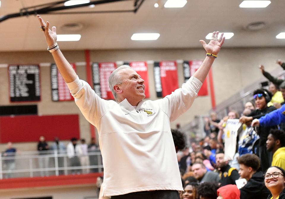 Lincoln Park coach Mike Bariski responds to the crowd after the Leopards defeated Uniontown during Monday's PIAA Class 4A semifinal game at Charleroi High School.