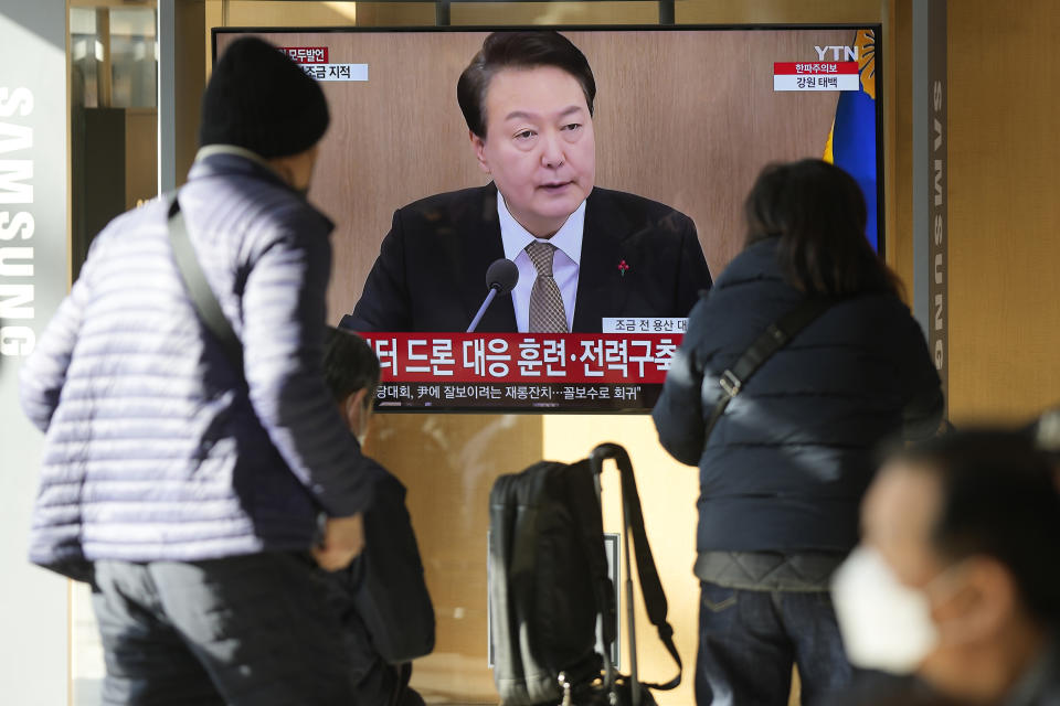 A TV screen shows a news program reporting about South Korean President Yoon Suk Yeol speaking during a cabinet council meeting, at the Seoul Railway Station in Seoul, South Korea, Tuesday, Dec. 27, 2022. President Yoon on Tuesday called for a stronger air defense and high-tech stealth drones to better monitor North Korea, a day after it accused five North Korea of flying drones across the rivals’ tense border for the first time in five years. (AP Photo/Lee Jin-man)