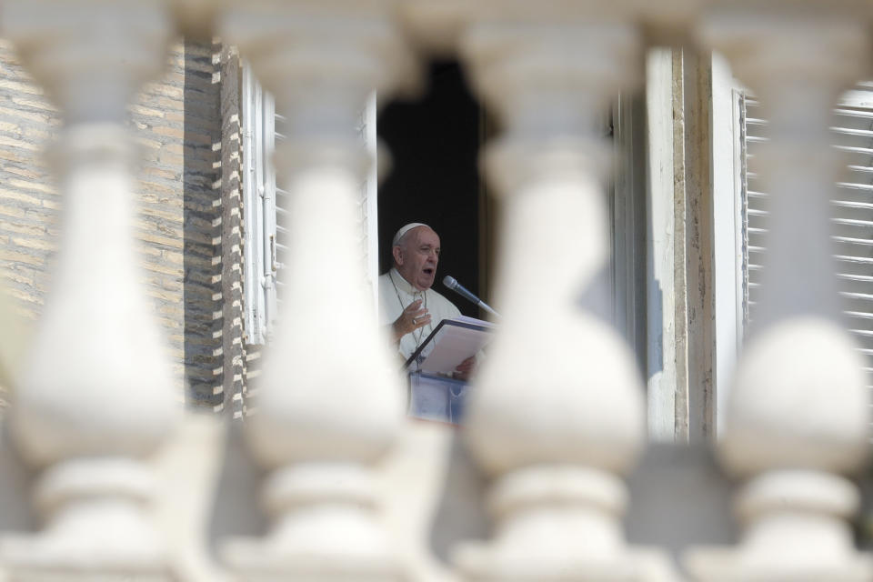Pope Francis delivers his blessing as he recites the Angelus noon prayer from the window of his studio overlooking St.Peter's Square, at the Vatican, Sunday, Sept. 13, 2020. (AP Photo/Andrew Medichini)