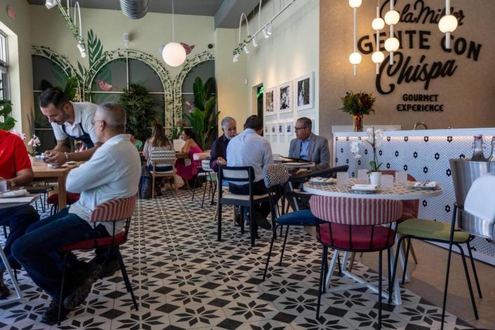 Customers enjoy lunch at CalaMillor Gourmet Experience, a new Spanish restaurant and market in Miami.