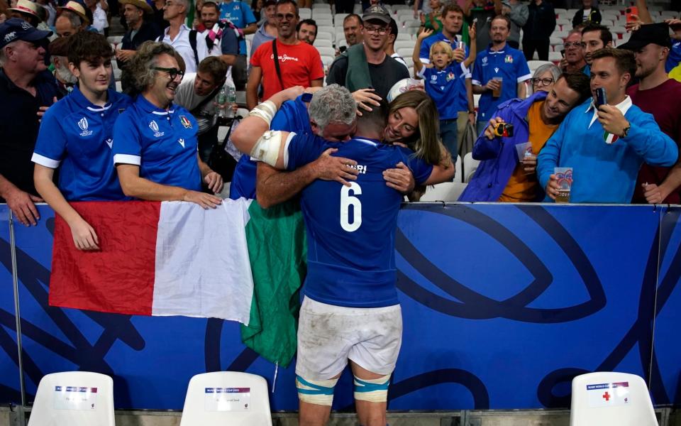 Italy's Sebastian Negri embraces supporters