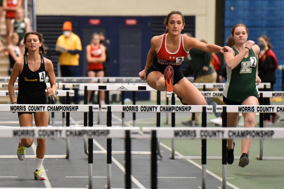 The Morris County Track & Field Championships are held at Drew University on January 18, 2022. Hanover Park's Courtney McGough, Mendham's Julia Schoenbrodt and Mia Corigliano of Kinnelon compete in a heat of the 55-meter hurdles.