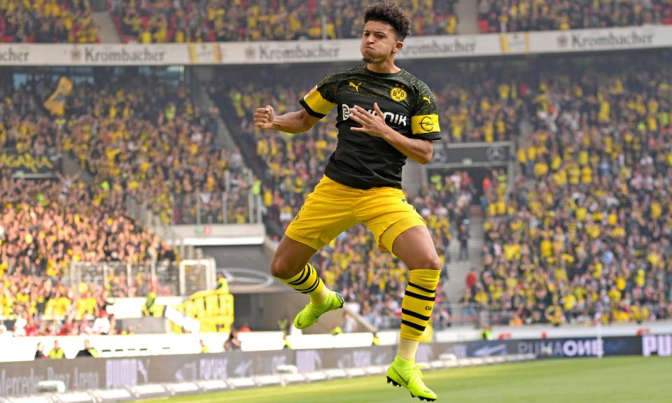 Jadon Sancho takes to the skies after scoring Borussia Dortmund’s opening goal at Stuttgart. The win extends their lead at the top of the Bundesliga to four points.