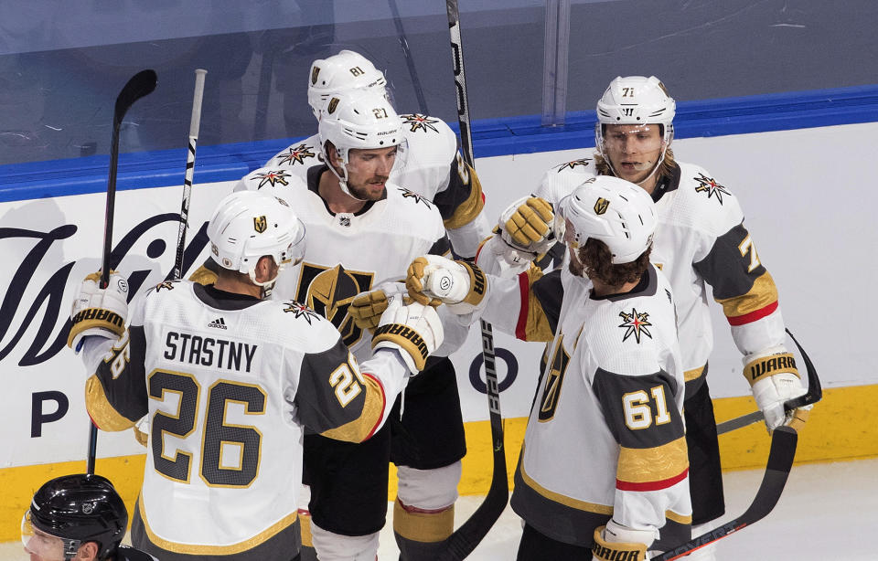 Vegas Golden Knights celebrate a goal during the second period of an NHL hockey playoff game against the St. Louis Blues Thursday, Aug. 6, 2020, in Edmonton, Alberta. (Jason Franson/Canadian Press via AP)