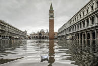 A boat made with a paper sheet floats in a flooded St. Mark's Square at Venice, Friday, Nov. 15, 2019.The high-water mark hit 187 centimeters (74 inches) late Tuesday, Nov. 12, 2019, meaning more than 85% of the city was flooded. The highest level ever recorded was 194 centimeters (76 inches) during infamous flooding in 1966. (AP Photo/Luca Bruno)