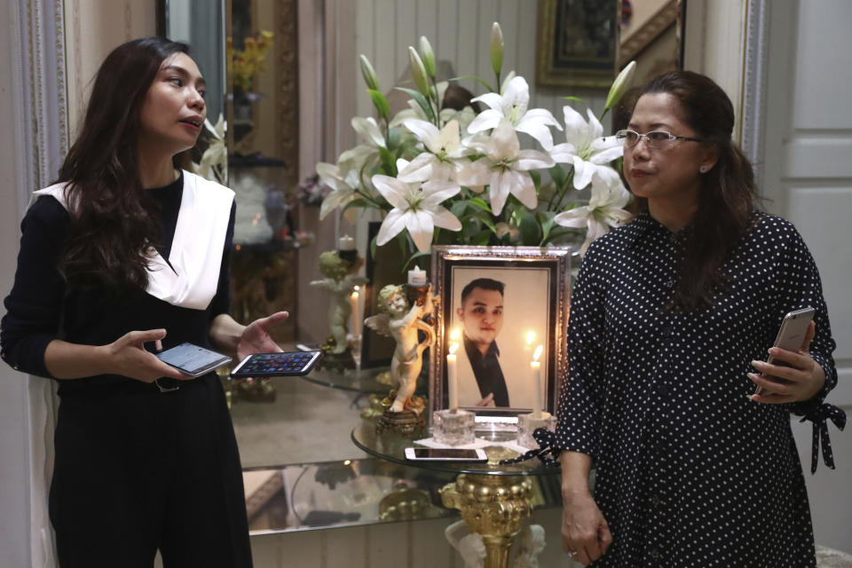 Fiance Tri Novia Septiani, left, and mother Herlina Simbala of Dr. Michael Robert Marampe attend an online memorial service to mark the 40th day since Marampe passed away due to COVID-19 in Jakarta, Indonesia, on June 5, 2020. Marampe knew what he wanted to be since he was a kid: a doctor and a pianist. He became both, and his passion for music even led him to Septiani - a woman he never got to marry because he got the coronavirus. Marampe became one of dozens of doctors the coronavirus has claimed so far in Indonesia. (AP Photo/Tatan Syuflana)