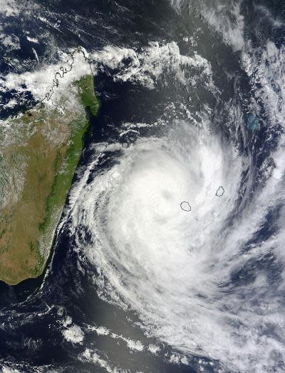 This visible image of Tropical Cyclone Dumile over La Reunion Island and Mauritius was captured by the MODIS instrument aboard NASA's Terra satellite on Jan. 3, 2013, at 0650 UTC. Dumile's center was just northwest of Reunion (left) and Mauriti