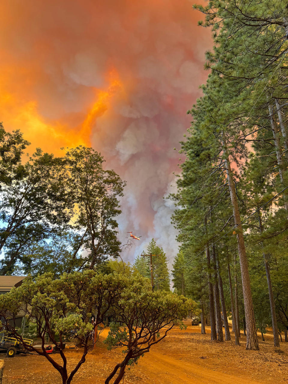 Ken Baker initially stayed behind to help extinguish the fire on his property. Firefighters eventually cleared a path for him to escape in his vehicle. (Courtesy Ken Baker)