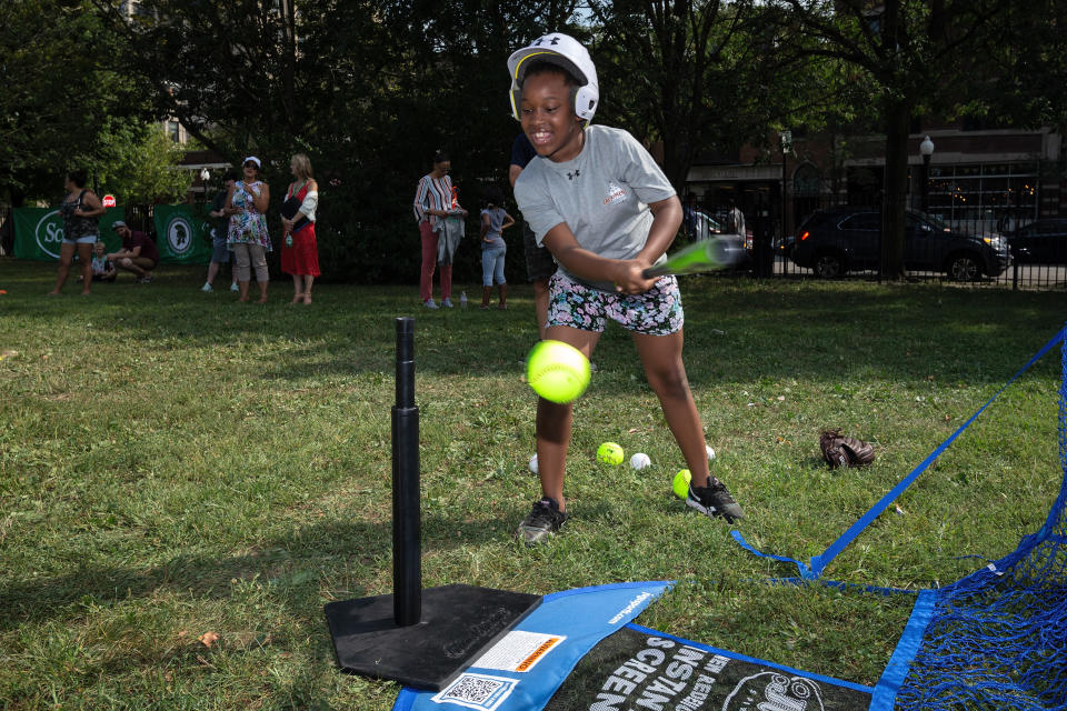 Ray Elementary students hits a ball off a tee. (Photo by Dylan Buell/MLB Photos via Getty Images)