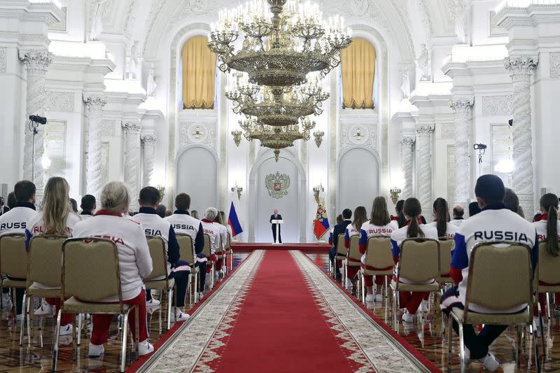 Russian President Vladimir Putin attends a meeting with the country's Olympic athletes in Moscow