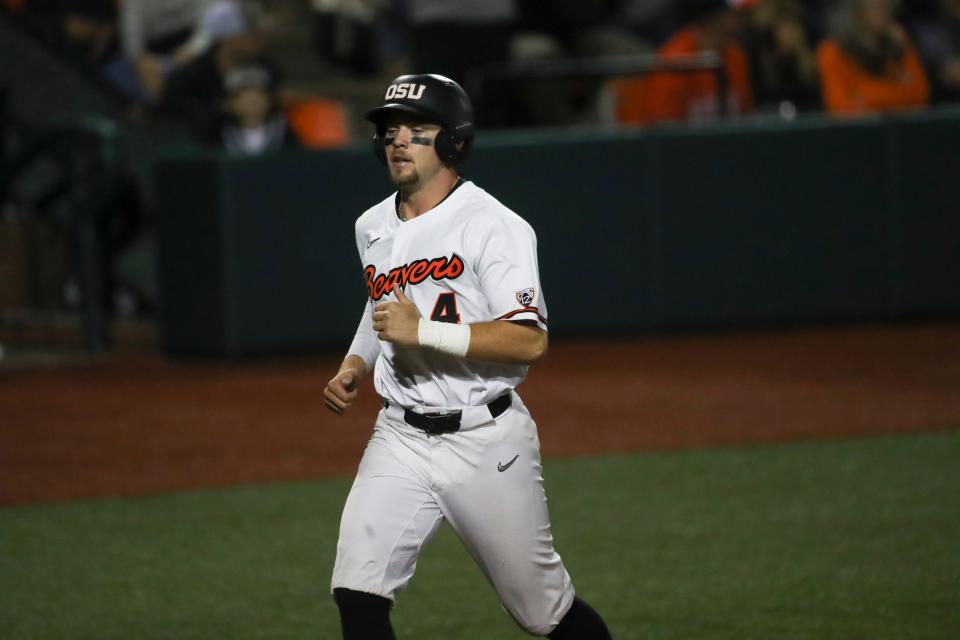 Oregon State's Justin Boyd scores on a double by Jacob Melton during the ninth inning of the team's NCAA college baseball tournament super regional game against Auburn on Saturday, June 11, 2022, in Corvallis, Ore. (AP Photo/Amanda Loman)