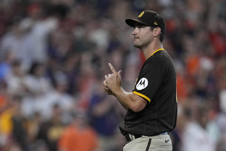 San Diego Padres starting pitcher Seth Lugo reacts after giving up a solo home run to Houston Astros designated hitter Yordan Alvarez during the third inning of a baseball game, Saturday, Sept. 9, 2023, in Houston. (AP Photo/Kevin M. Cox)